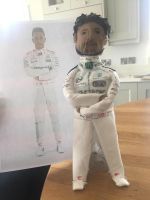 A biography bottle of Lewis Hamilton with Mrs Barrett and her co-pilot