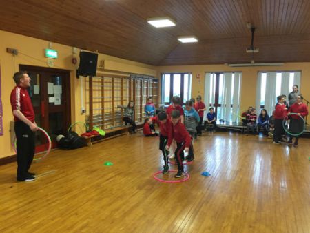 P6 & P7 playing a problem solving game during PE with Macartan.