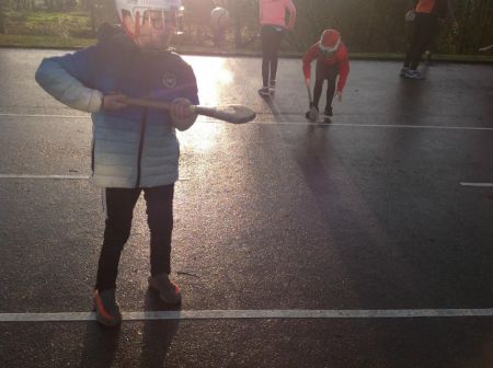 P6 & P7 hurlers practising some hurling skills.